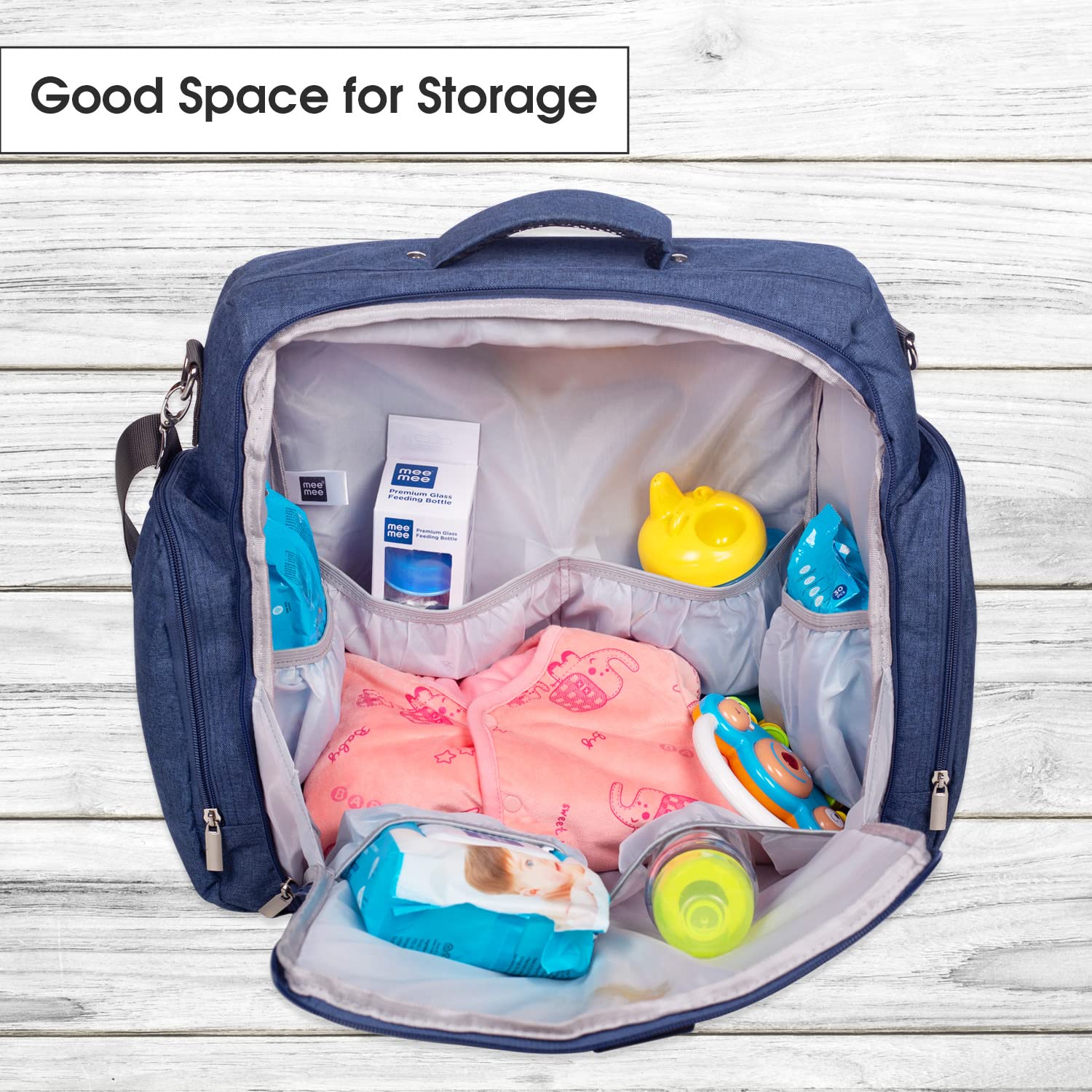 Spacious blue Mee Mee diaper bag with multiple zippered pockets, padded handles, and an adjustable shoulder strap for parents. www.usmile.toys